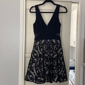 Solid Black & Floral Cocktail Dress with Illusion deep-V Side Detail